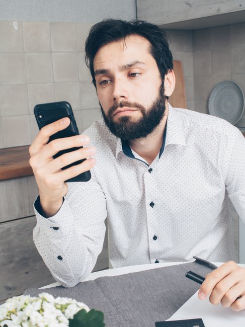 frustrated user holding smartphone showing account binding error
