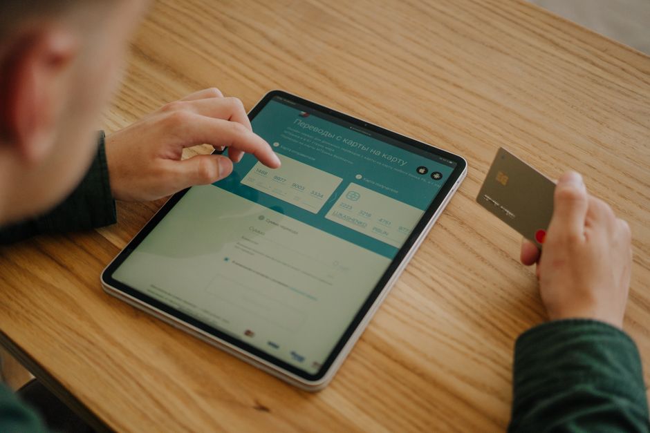 person using VPN and credit card for online payment illustration