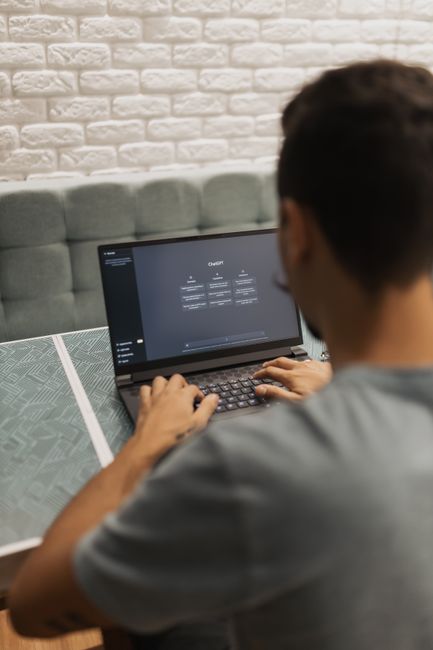 Developer working on a laptop using Codex AI assistant