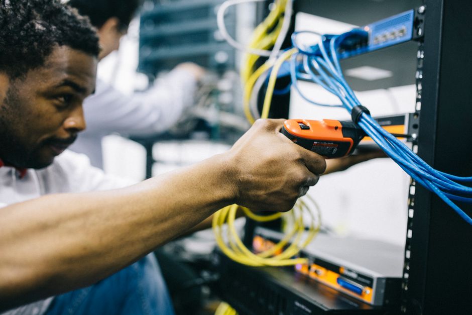 technicians working on server racks installation