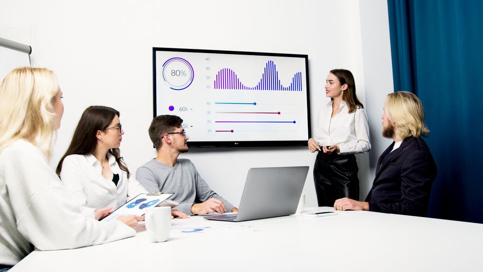 product managers showing AI agent generated products to boss in a meeting room